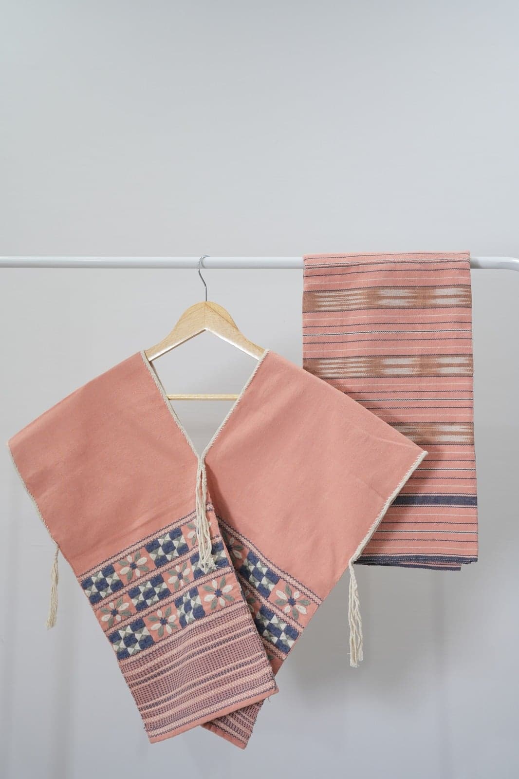 Pink linen dresses on hangers